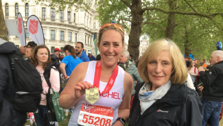Rachel Seymour is greeted at the finish line of the London Marathon