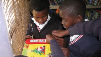 Learners reading at Qolora Education Centre