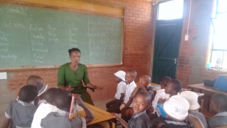 Story time at Tsoelo-Pele 'Moho Primary School reading club