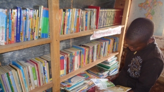 Learner reading at Bumba Primary School